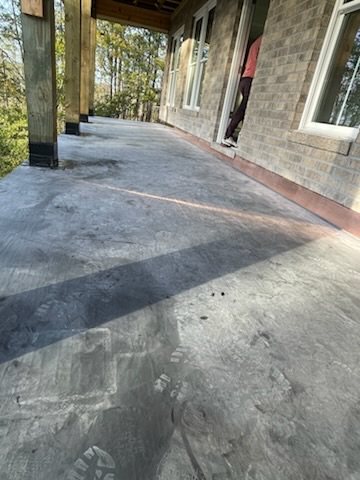 Low-slope deck waterproofing detail near a wall edge