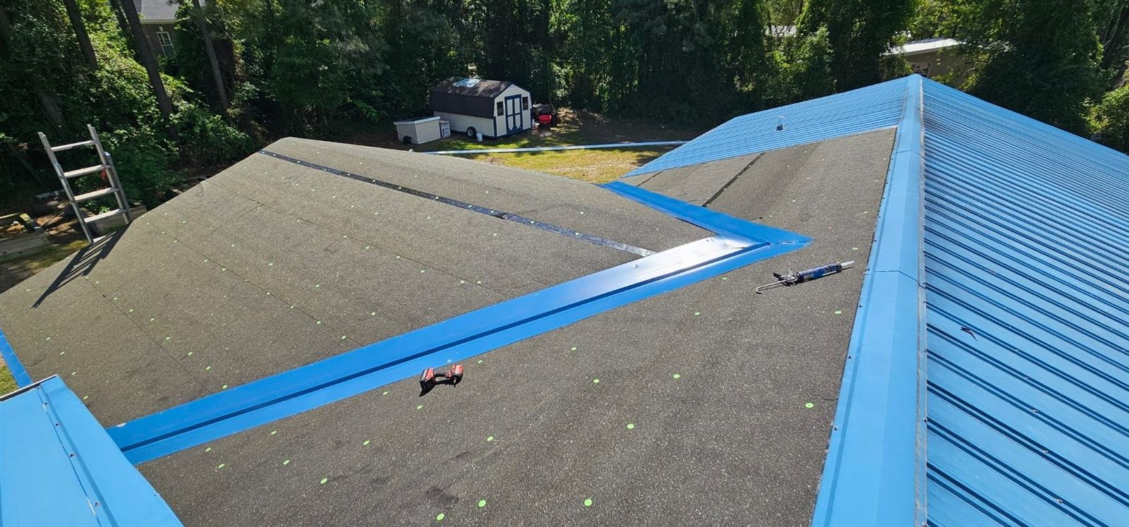 Metal roof transition with underlayment and panel edge detail
