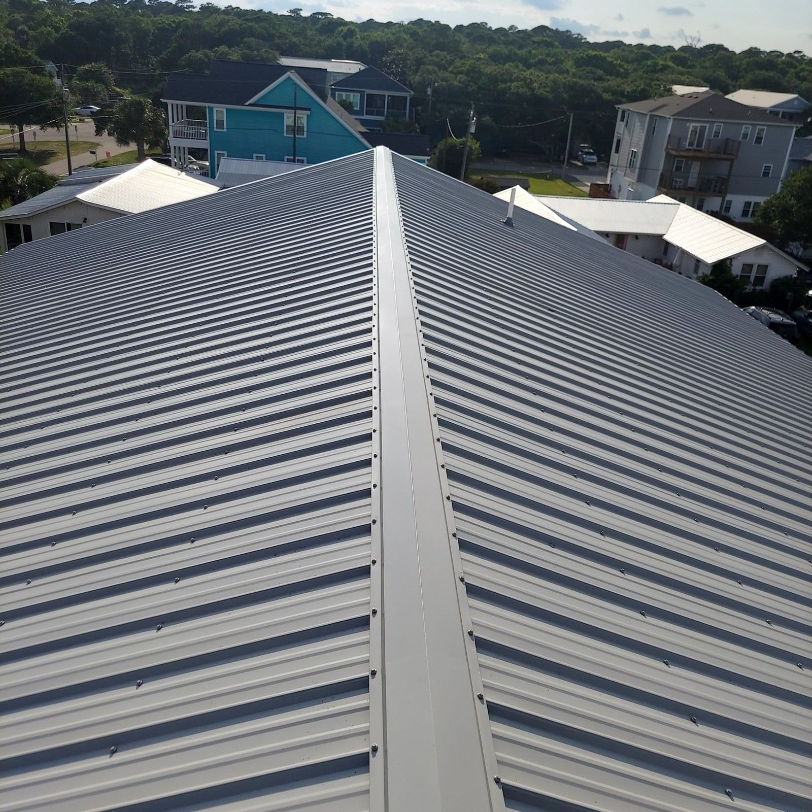 Finished silver metal roofline in a coastal neighborhood