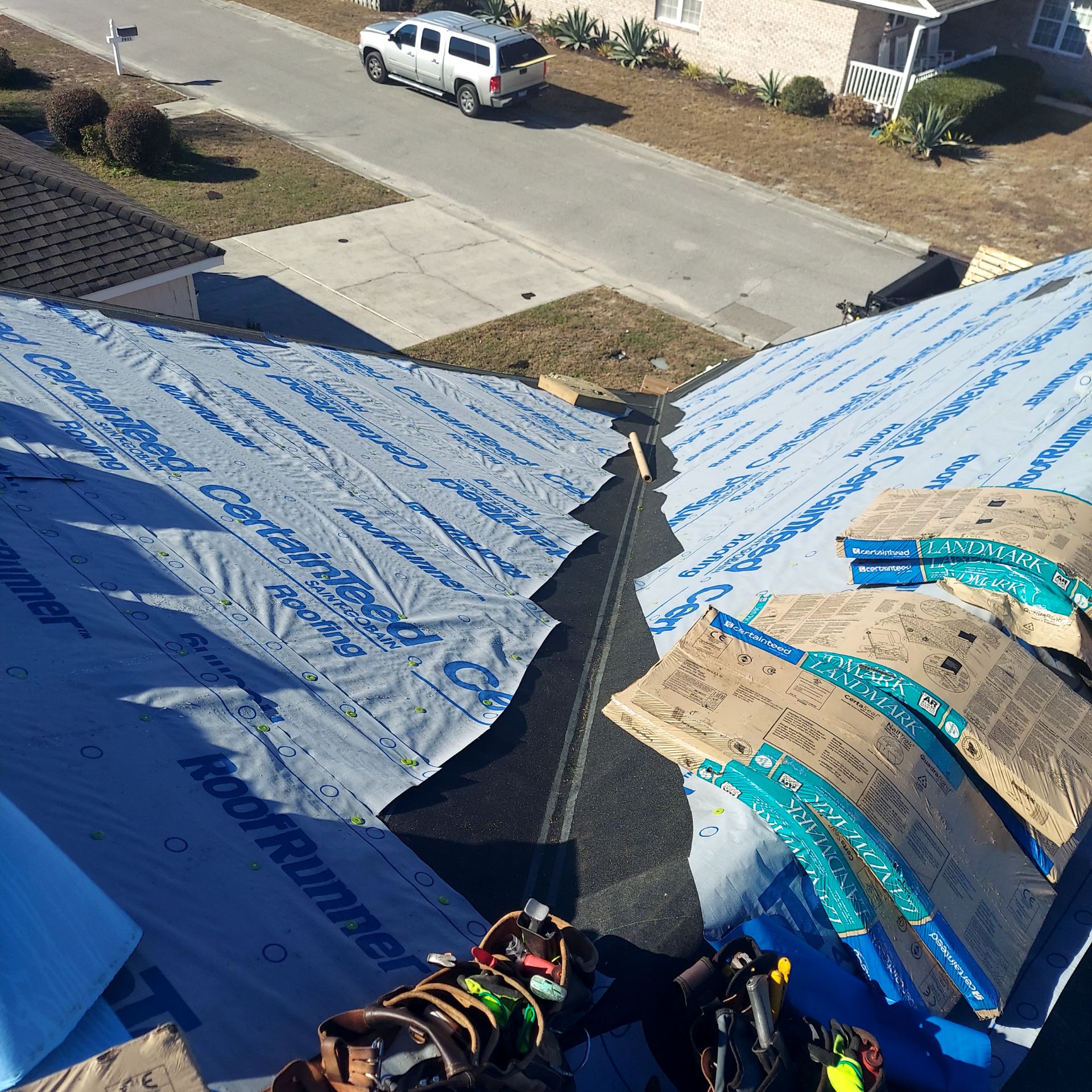 Roof underlayment installed around a roof valley during preparation